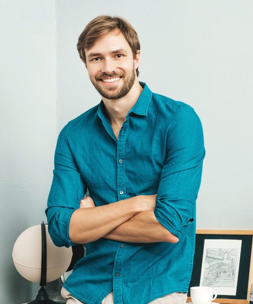 portrait-of-young-handsome-man-posing-in-the-offic-resize.jpg